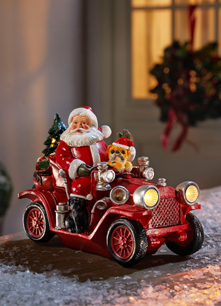 Weihnachtsmann mit Oldtimer aus Polyresin